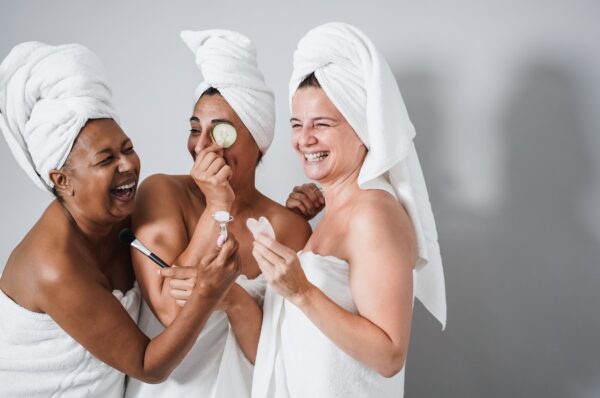 Multigenerational women having fun using skin care products - Skin care therapy